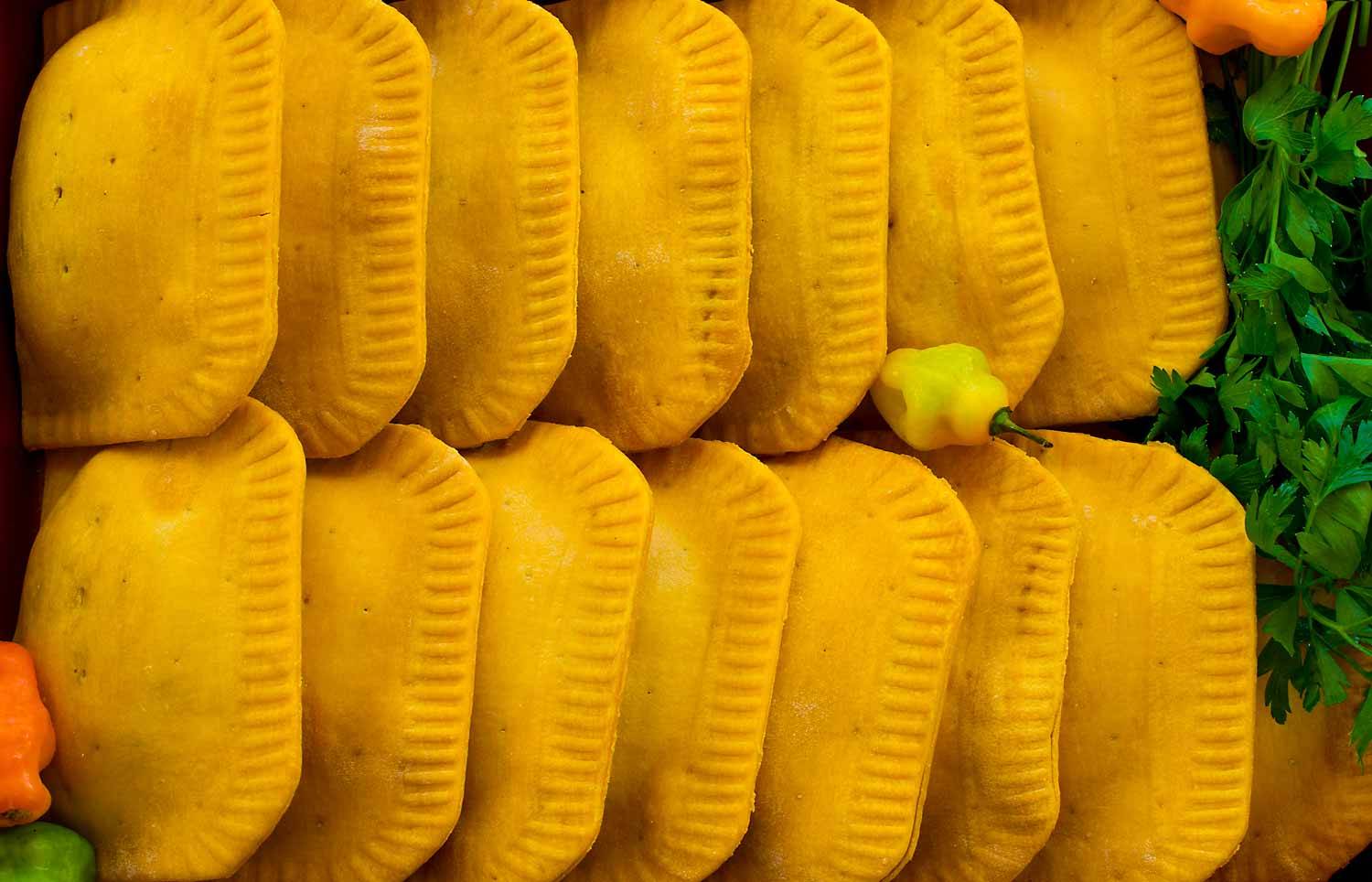 Rows of golden Majesty Foods Jamaican patties